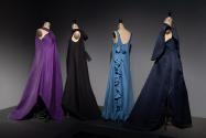 Dior + Balenciaga, Left to right 71.240.4 (purple evening dress), P85.89.1 (black evening dress), 91.183.16 (blue evening dress), 86.66.4 (blue evening dress and capelet)
