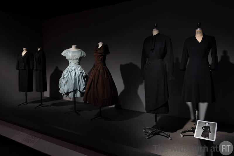 Dior + Balenciaga, Left to right: PL74.1.30 (suit), 77.116.5 (suit), 70.57.54 (blue dress), 69.153.3 (brown dress), PL74.1.2 (top and skirt), P91.78.2 (black dress)