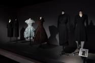 Dior + Balenciaga, Left to right: PL74.1.30 (suit), 77.116.5 (suit), 70.57.54 (blue dress), 69.153.3 (brown dress), PL74.1.2 (top and skirt), P91.78.2 (black dress)