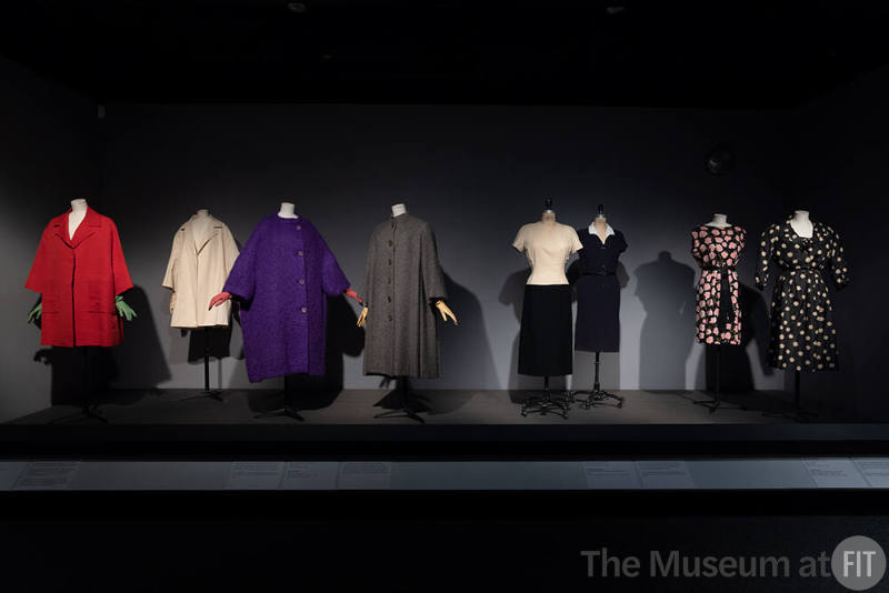 Dior + Balenciaga, Left to right: 70.64.1 (red coat), muslin Toile by Ellen Shanley, former MFIT curator, 71.265.20 (purple coat), 93.61.1 (grey coat), 71.213.13 (ivory and black dress), 75.82.44 (blue dress), 86.106.4 (floral dress), PL74.1.3 (ensemble)