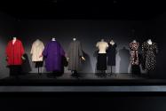 Dior + Balenciaga, Left to right: 70.64.1 (red coat), muslin Toile by Ellen Shanley, former MFIT curator, 71.265.20 (purple coat), 93.61.1 (grey coat), 71.213.13 (ivory and black dress), 75.82.44 (blue dress), 86.106.4 (floral dress), PL74.1.3 (ensemble)