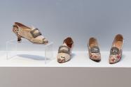 A pairing of 18th-century and early 20th-century shoes from the Identity: Historical Inspirations section. 