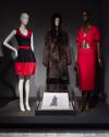 From left to right: 2010.63.1 (black and red dress), 98.38.2 (coat), 98.84.1 (sketch case) and 2010.55.1 (red suit)