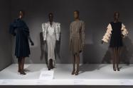 A selection from Tucks and Ruffles. From left to right: evening coat by Mae and Hattie Green, c.1929 (95.145.18); dress by Thierry Mugler, fall 1979 (2004.49.4); ensemble by Armani, 1982 (90.99.1); dress by Rudi Gernreich, 1967 (86.136.10).