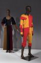 Dress by Yves Saint Laurent Rive Gauche, 1970 (left, 76.201.2); man's ensemble by Vivienne Westwood, spring 1989 (right, P89.60.2)