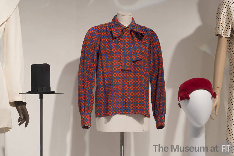 From left to right: Carey Adina novelty bag, 1987 (87.113.1); Yves Saint Laurent Rive Gauche blouse, c.1972 (2015.65.17); Paulette hat, c.1965 (72.112.137)