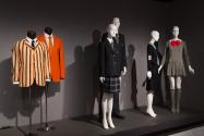 Uniformity_20  Left to right P89.40.25 (striped jacket), 2012.2.1 (jacket), 2010.24.3 (girl's uniform), 2010.24.4 (suit uniform), 2015.60.1(skirt uniform),  75.112.5 (mini dress)