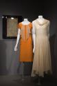 Eco-Fashion_32 Left to right X428 (textile wall), 80.50.2 (orange dress), P83.39.7 (dress)
