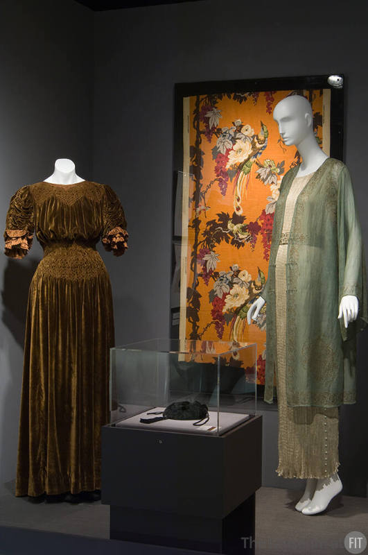 Fashion and Politics_35 Left to right P90.83.2 (dress), 84.162.43A (textile wall), 82.182.9 (bag case), 80.262.1 and 2001.67.2 (dress and coat)
