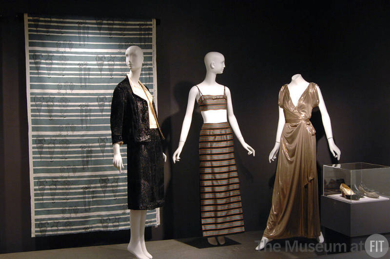 Arbiters_11 Left to right 2002.45.1 (textile wall), 90.97.3 (suit), 2007.46.61 (bra and skirt), 2008.34.2 (metallic dress), 89.164.133, 89.164.130 and 75.230.104 (shoes case)
