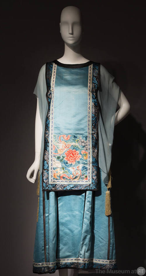 Blue sleeveless tunic with panel of Chinese floral and butterfly embroidery over long dress wit…