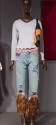 Alternate view of grey shirt and feathered jeans ensemble dressed on a platform