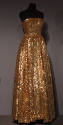 Gold allover sequinned strapless floor length evening dress with fitted bodice and full skirt
