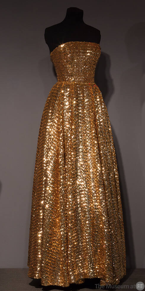 Gold allover sequinned strapless floor length evening dress with fitted bodice and full skirt