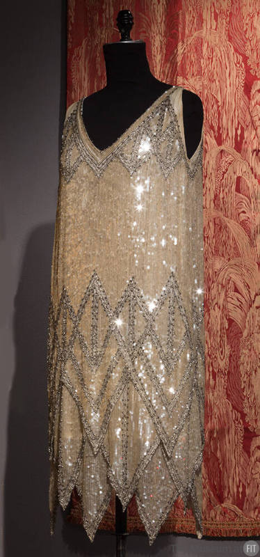 Silver and white sequinned evening flapper dress with layered diamond border design