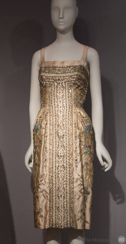 Ivory cocktail dress embroidered in metallic floral design, blue feathers and beads with thin c…