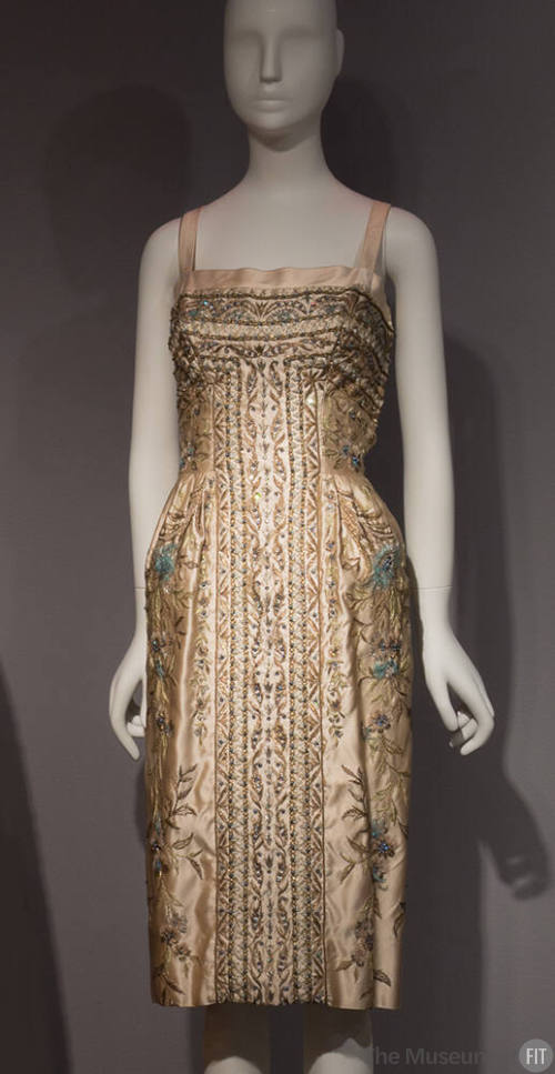 Ivory cocktail dress embroidered in metallic floral design, blue feathers and beads with thin c…