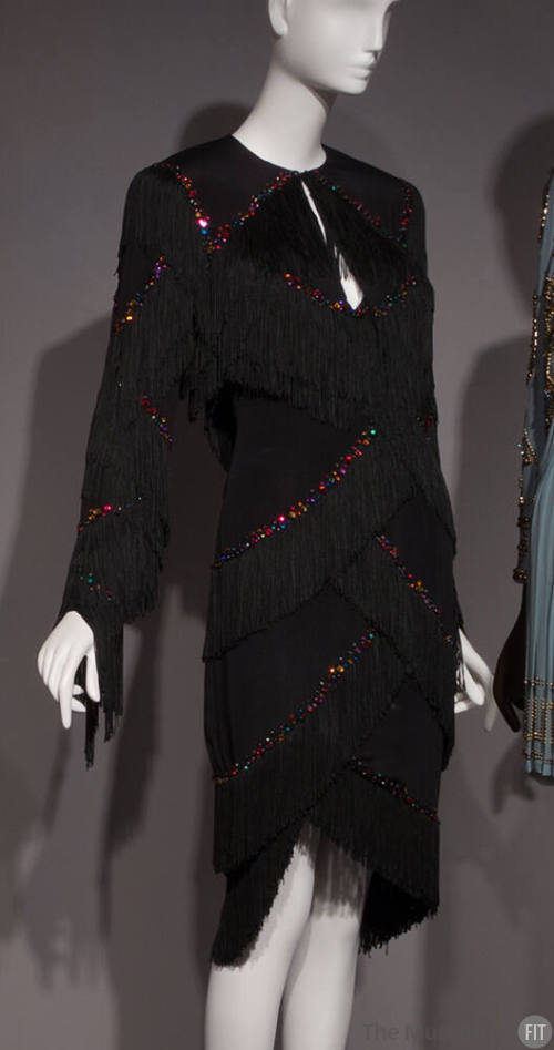 Black evening set: strapless short dress and bolero jacket with scalloped rows of rayon fringe …