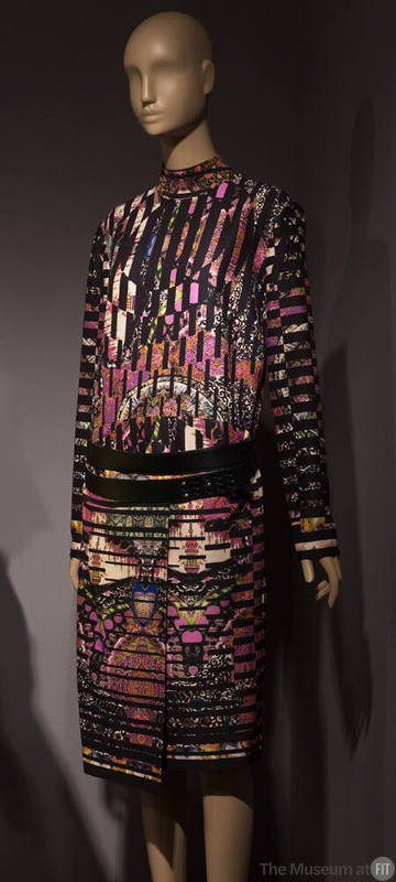 Multicolor abstract print long sleeve dress with asymmetrical wrap skirt and black leather belt…