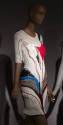White knit above-the-knee dress with red, blue black and grey abstract stitching, 3/4 sleeves a…