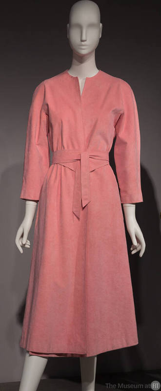 Pink Ultrasuede calf length wrap dress with V-neckline, long sleeves and large tie belt