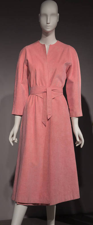 Pink Ultrasuede calf length wrap dress with V-neckline, long sleeves and large tie belt