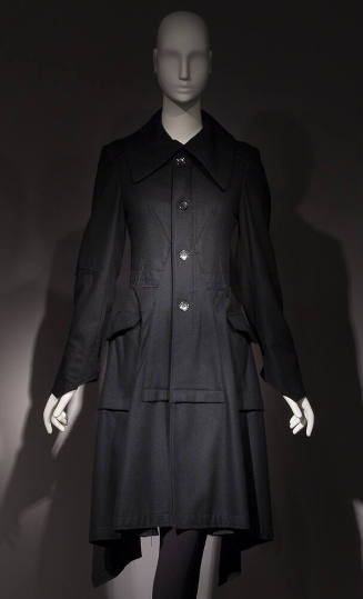 Black long sleeve four button front to-the-knee coat with large collar, patch hip pockets 