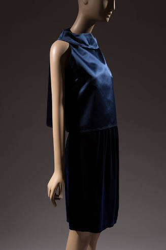 Blue set of sleeveless top with stand away bateau neckline and matching knee length straight sk…