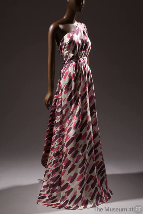 White one shoulder floor length evening gown with pink and purple brushstrokes, fitted waist an…