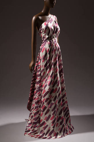 White one shoulder floor length evening gown with pink and purple brushstrokes, fitted waist an…