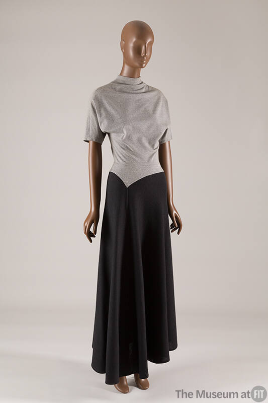 Two tone short sleeve dress with light grey bodice, mock turtleneck, and dark gray ankle length…