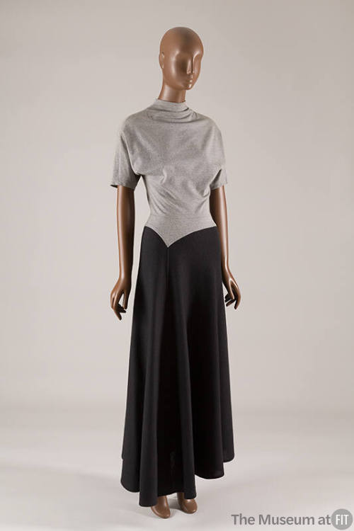 Two tone short sleeve dress with light grey bodice, mock turtleneck, and dark gray ankle length…