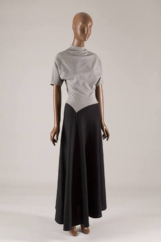 Two tone short sleeve dress with light grey bodice, mock turtleneck, and dark gray ankle length…