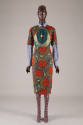 ¾ sleeve knee length shirt dress with orange stylized geometric motifs and blue, green and gold…