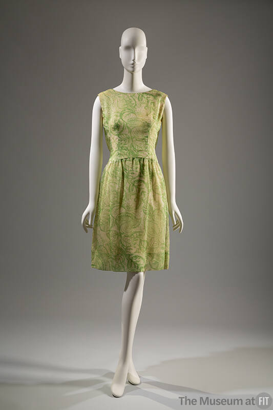 Green and white sleeveless knee-length sheath dress with printed leaves