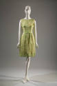 Green and white sleeveless knee-length sheath dress with printed leaves