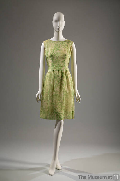 Green and white sleeveless knee-length sheath dress with printed leaves