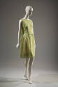 3/4 view of green and white sheath dress 