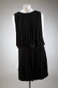 Black fringed sleeveless mini-dress showing rhinestone belt buckle at waist