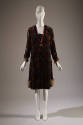 Black/ mulitcolor long sleeve dress with velvet pattern, pink ribbon trim V at neck, fur cuffs …