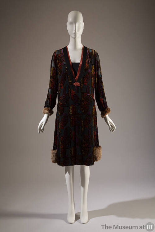 Black/ mulitcolor long sleeve dress with velvet pattern, pink ribbon trim V at neck, fur cuffs …