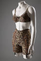 ¾ view of leopard print bra and girdle set with black garter buckles on legs