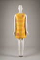 Back view: Sleeveless yellow knee-length dress with horizontal wavy orange sections and intersp…