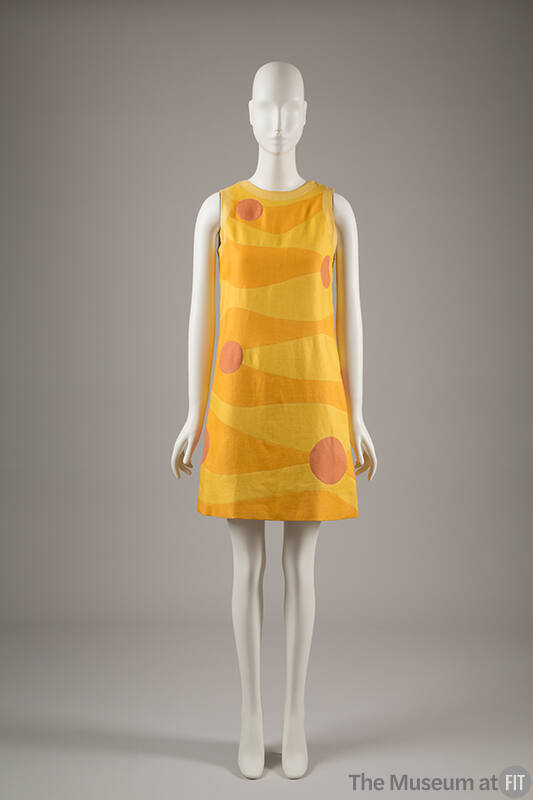 Front View: Sleeveless yellow knee-length dress with horizontal wavy orange sections and inters…
