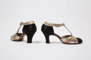 Alternate view of gold and silver metallic shoes with black toe, T-strap and heels