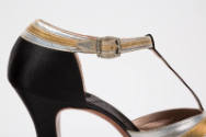 Detail of gold and silver metallic ankle strap with rhinestone buckle