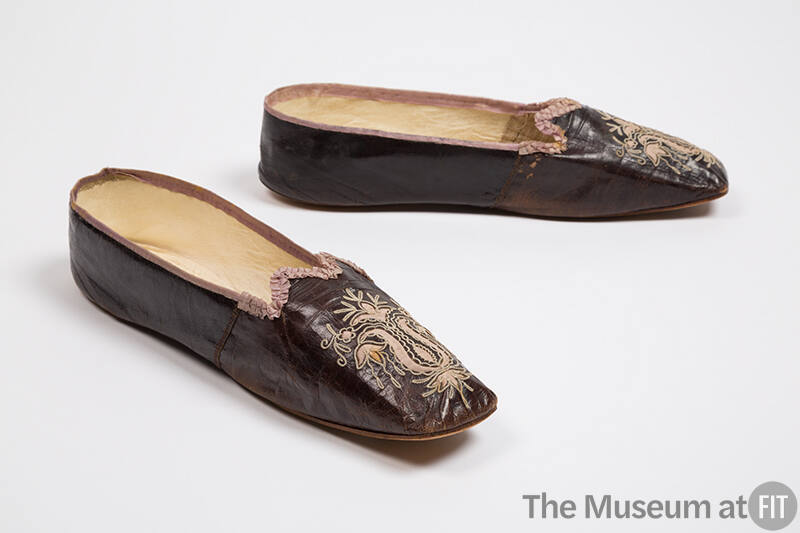 Pair of dark purple/brown leather slippers with rounded square toe, light purple floral cutout …
