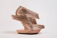 Rose gold multi-level platform ankle boot style shoe with horizontal ribbed mirrored surface te…