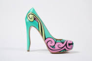 Side view of single aqua green pump showing pink, light green and black swirl design across sid…