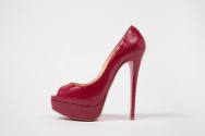 Side view of red snakeskin open toe high heel pumps with front platform sole